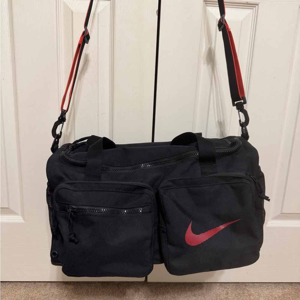 Nike Men's Black Gym Bag with Red Accents